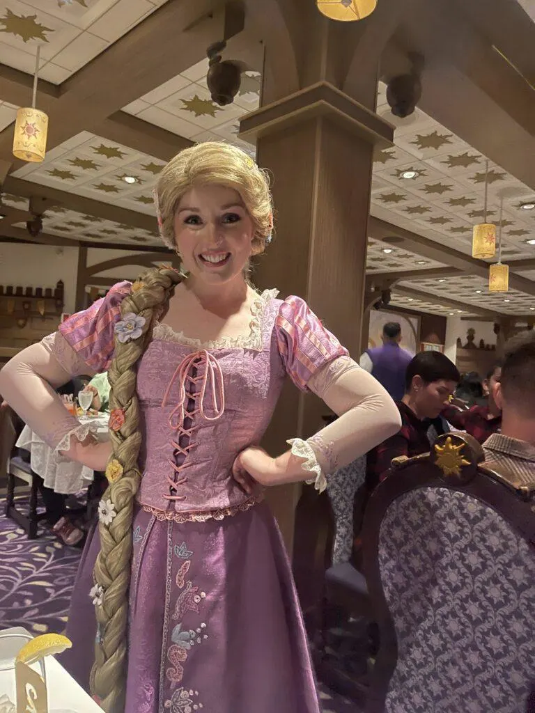 Rapunzel greeting guests at Rapunzel&rsquo;s Royal Table on the Disney Magic